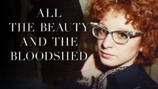 The head and shoulders of a white woman with red curly hair and vintage glasses next to text reading "All the Beauty and the Bloodshed.
